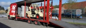 Lutter Spedition NRW - Betriebsumzüge - Maschinentransport - Logistik - Maschine und Bakran auf Lkw Ladeflaeche